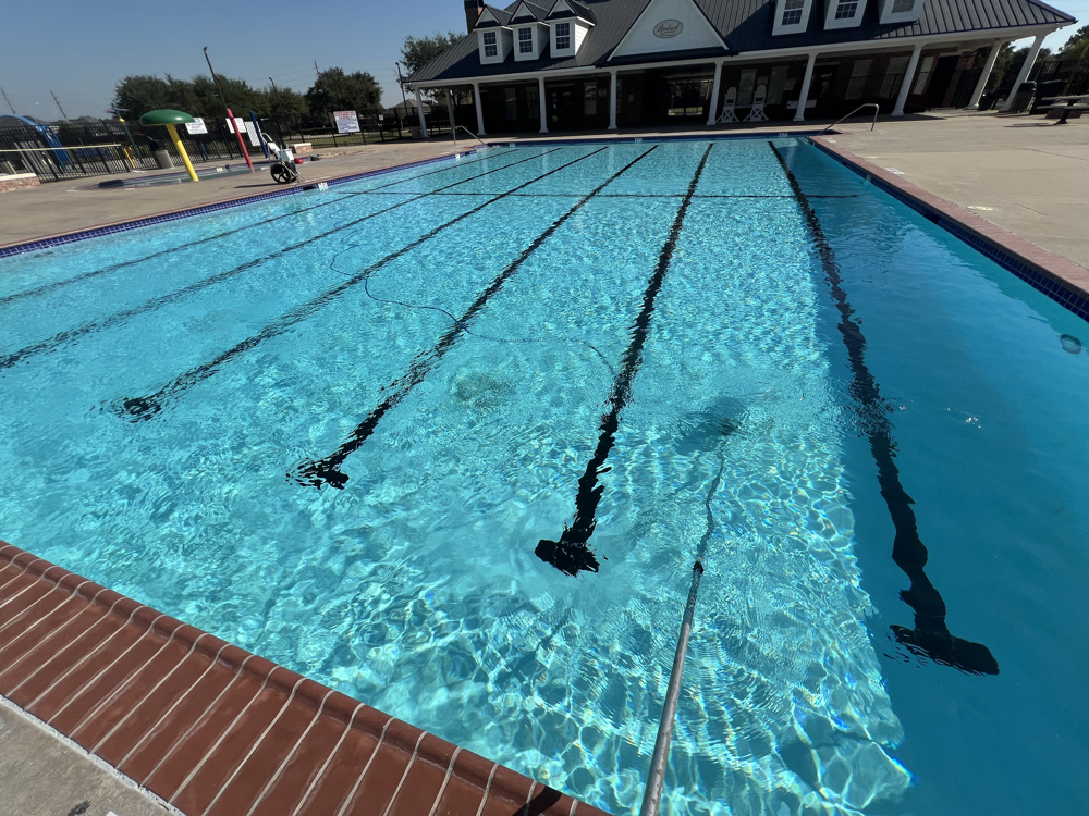 Community pool vacuuming by ATX AquaTechs